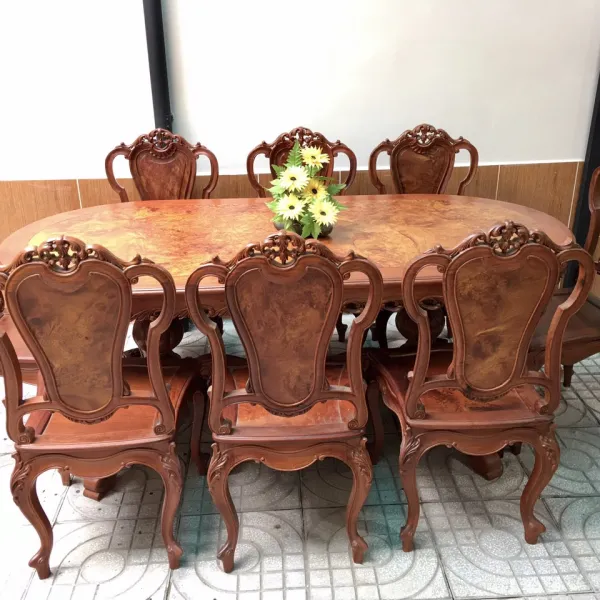 Bàn ovan 2 trụ cổ điển 8 ghế gỗ hương mặt nu hương diềm chạm mẫu  Alexander